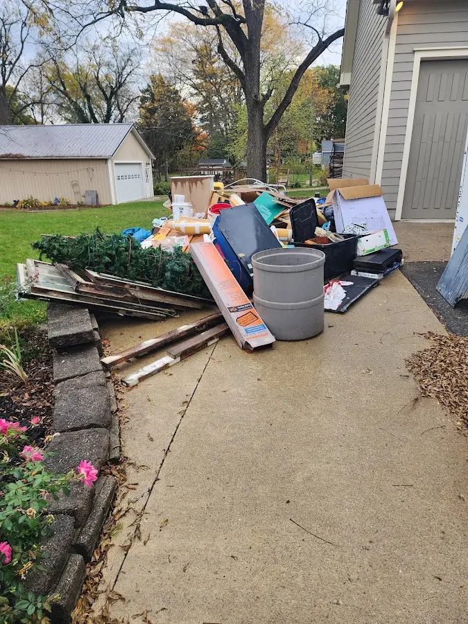 Dumpster being loaded with debris for 10 Yard Dumpster Rental in South Lakes